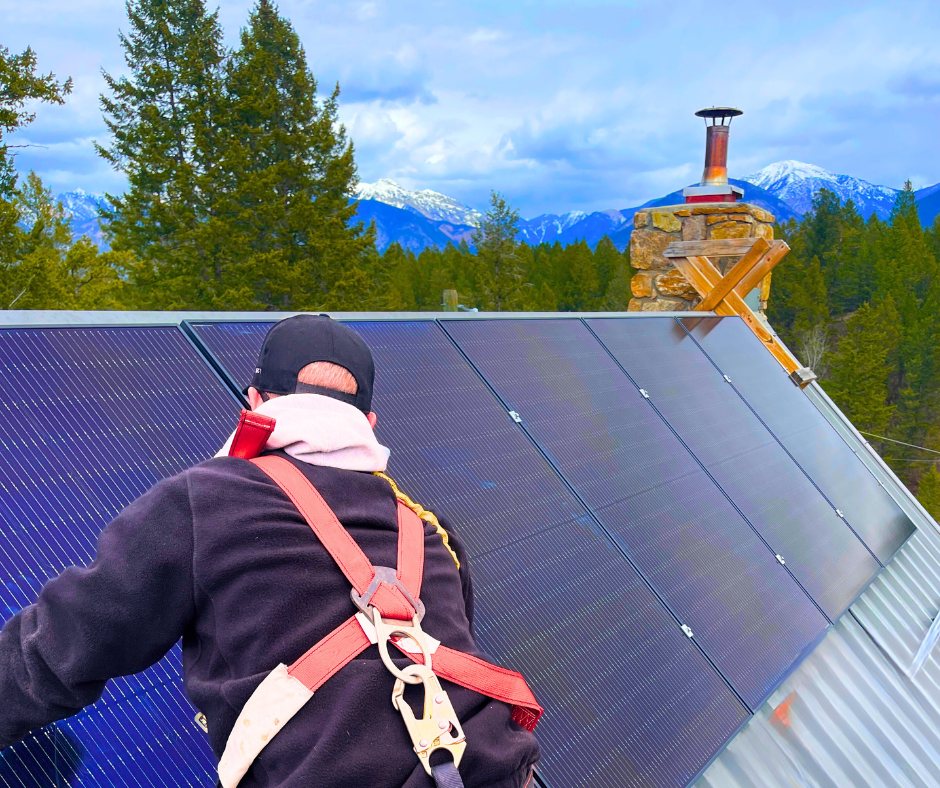 Technician installing rooftop solar panels on an Alberta home, part of a clean energy upgrade that may qualify for available rebate programs