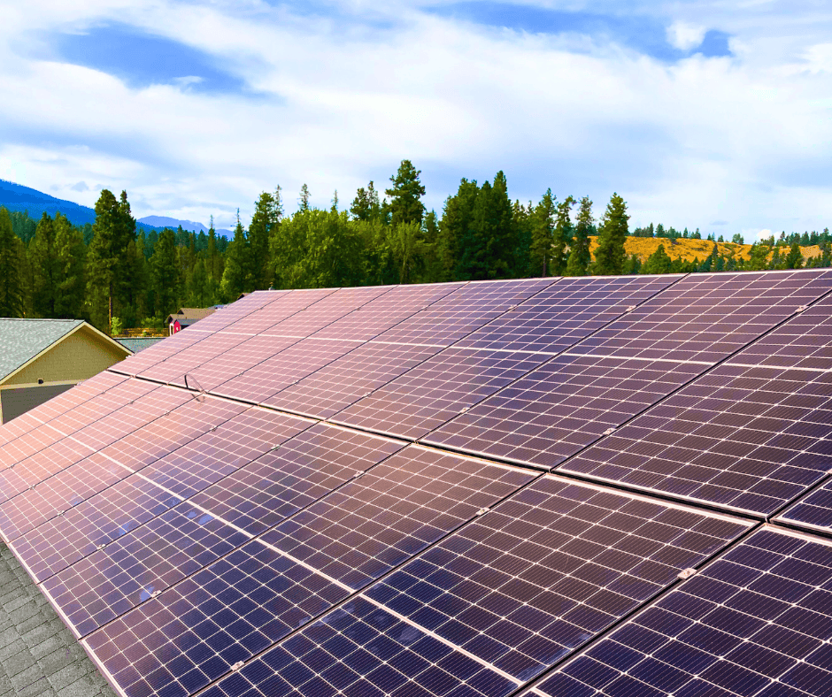 Large rooftop solar panel array on an Alberta building, highlighting clean energy installations eligible for local and federal rebate programs
